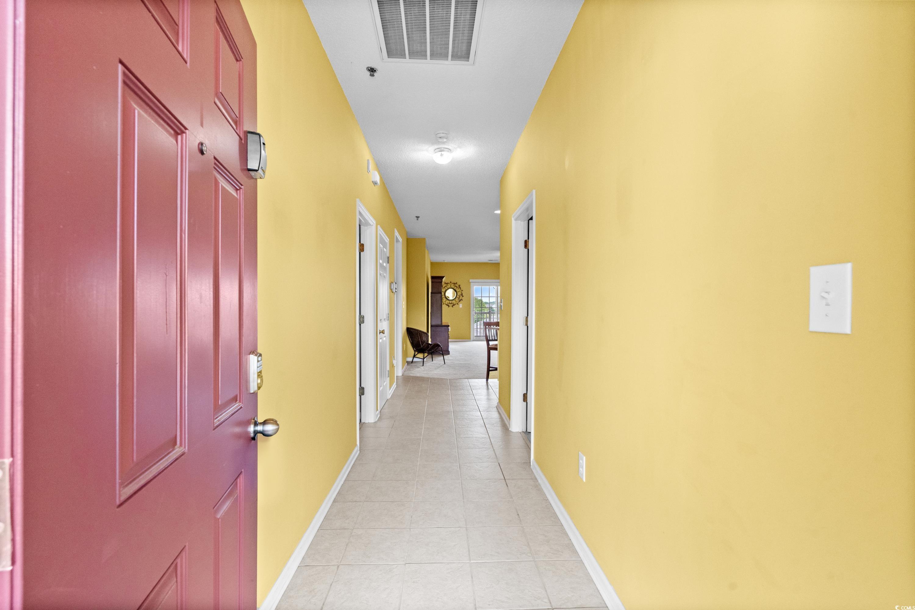 2050 Cross Gate Boulevard, Unit 303 Myrtle Beach, SC 29575 - Photo 3 of 35 Hall with light tile patterned floors