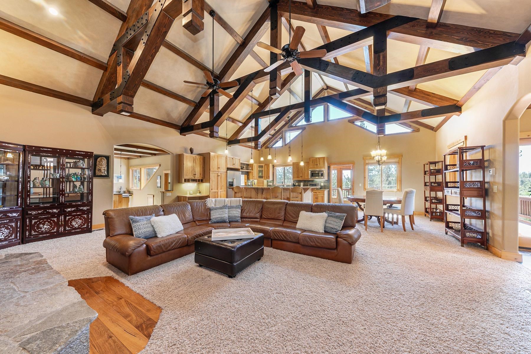 14070 Alder Creek Road Truckee, CA 96161 - Photo 4 of 28 a living room with furniture and a chandelier