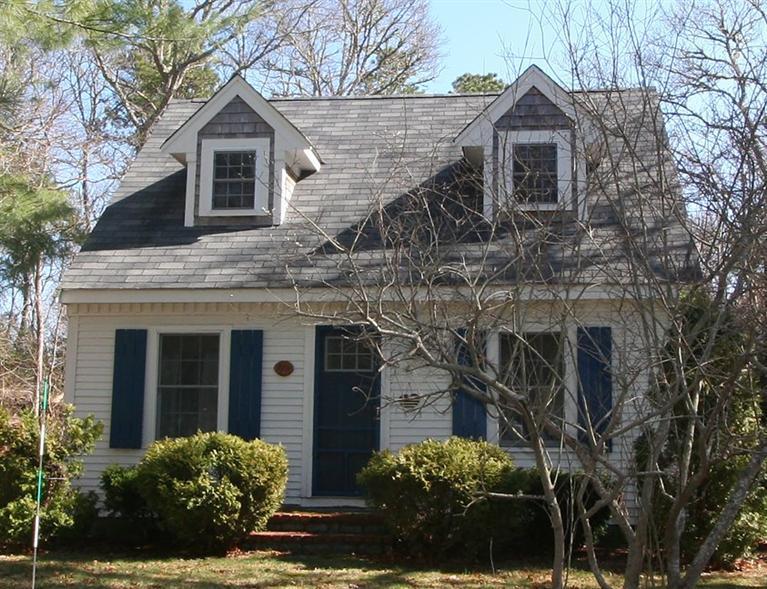 118 Richardson Road Centerville, MA 02632 - Photo 1 of 27 a front view of a house with garden