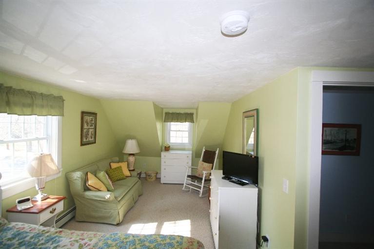 118 Richardson Road Centerville, MA 02632 - Photo 14 of 27 a living room with furniture and a flat screen tv