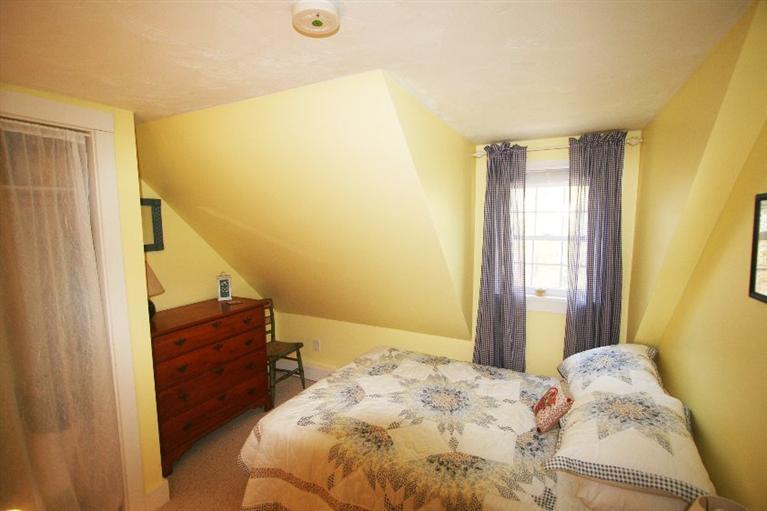 118 Richardson Road Centerville, MA 02632 - Photo 17 of 27 a bedroom with a bed and wall painting
