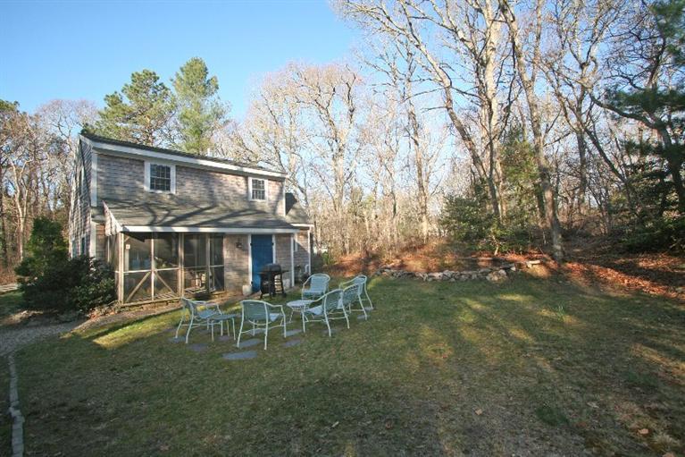 118 Richardson Road Centerville, MA 02632 - Photo 6 of 27 a backyard of a house with table and chairs