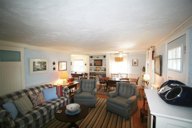 118 Richardson Road Centerville, MA 02632 - Photo 7 of 27 a living room with furniture and a wooden floor