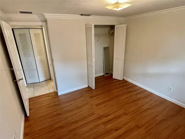 a bathroom with a sink mirror vanity and toilet