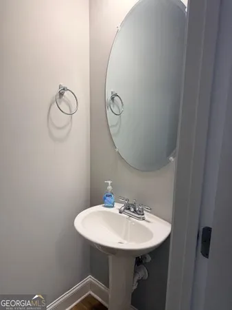 a bathroom with a sink and mirror