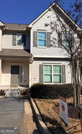 a front view of a house with yard