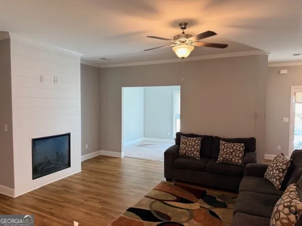 a living room with furniture and a fireplace