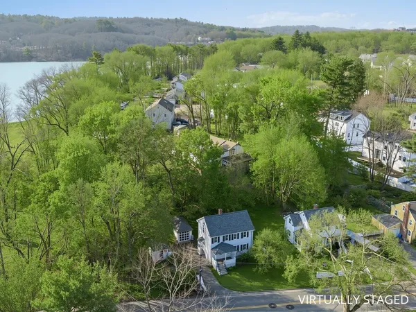 an aerial view of a house with yard