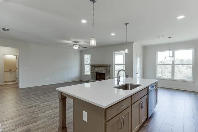 a kitchen with a table and chairs
