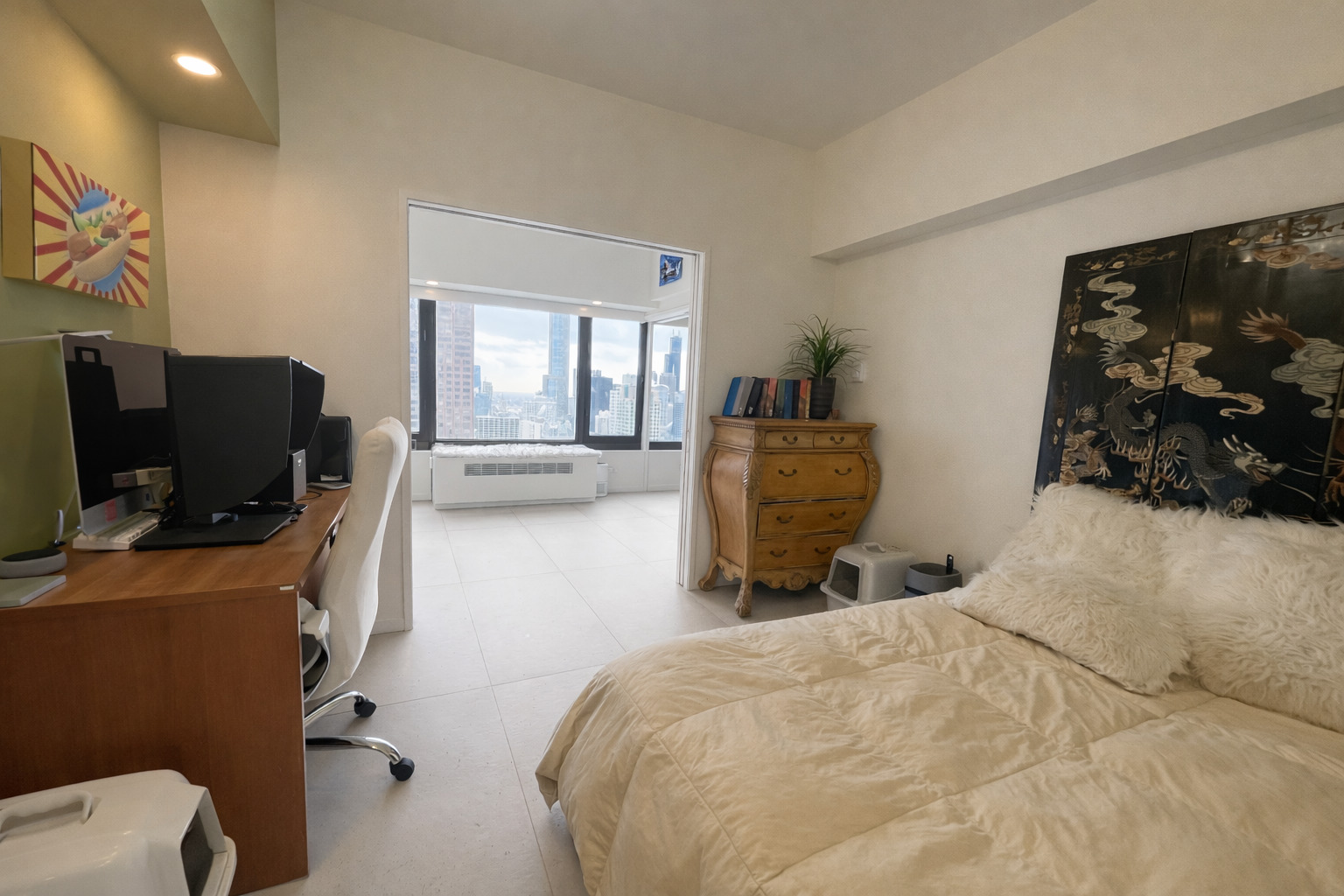 175 East Delaware Place, Unit 4723 Chicago, IL 60611 - Photo 17 of 26 a bedroom with a bed and furniture