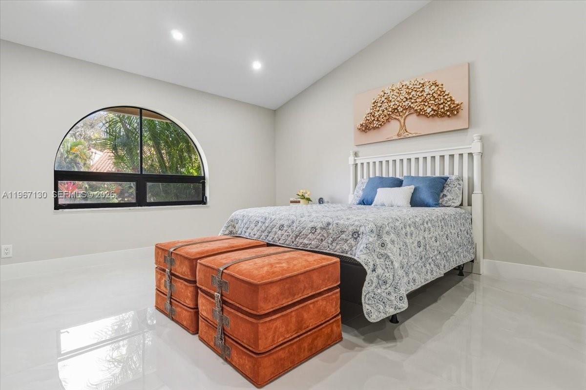 22708 Meridiana Drive Boca Raton, FL 33433 - Photo 19 of 49 a bedroom with a bed and a window