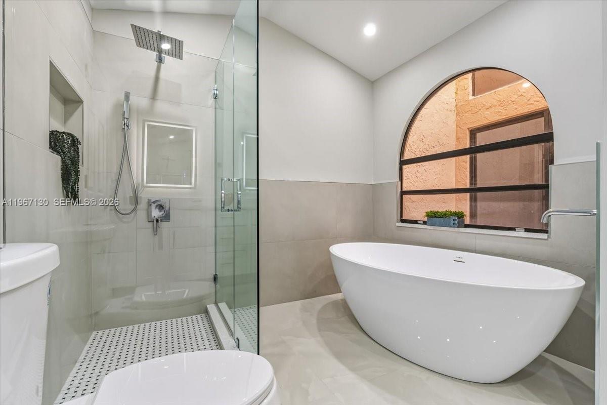 22708 Meridiana Drive Boca Raton, FL 33433 - Photo 25 of 49 a bathroom with a sink and a mirror