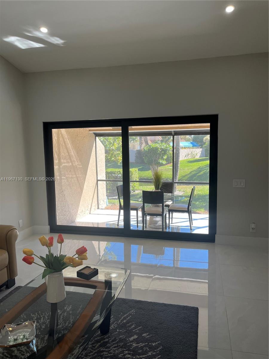 22708 Meridiana Drive Boca Raton, FL 33433 - Photo 31 of 49 a bathroom with a granite countertop sink and a large mirror next to a window