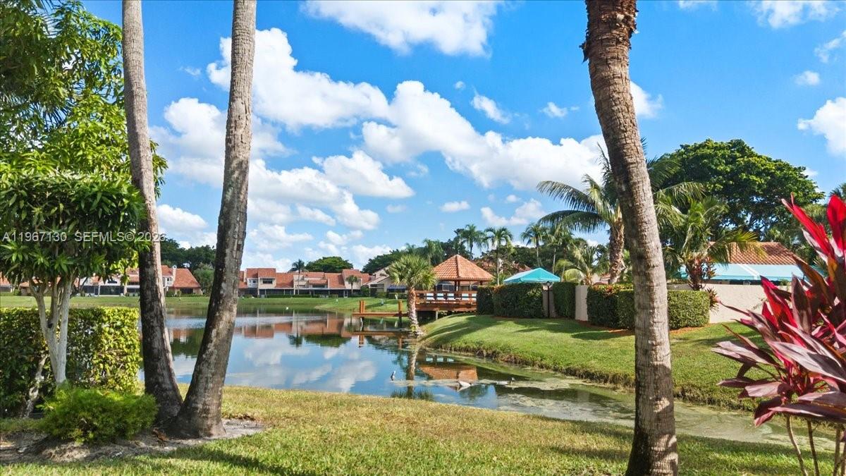 22708 Meridiana Drive Boca Raton, FL 33433 - Photo 45 of 49 a view of a lake with a big yard