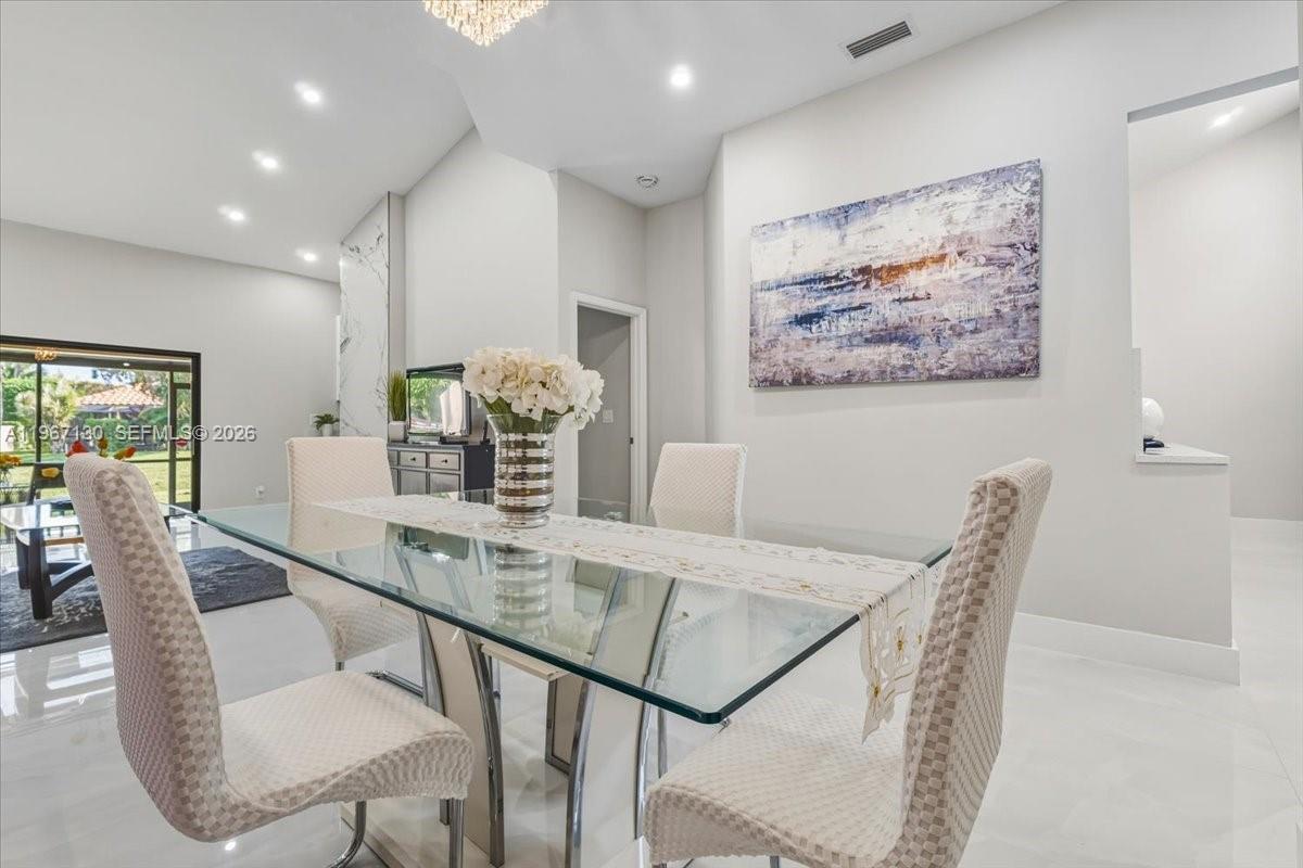 22708 Meridiana Drive Boca Raton, FL 33433 - Photo 6 of 49 a view of a dining room with furniture