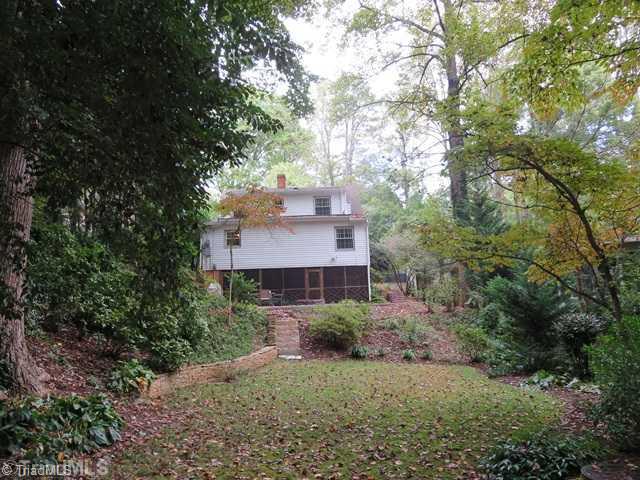 1760 Robinhood Road Winston-Salem, NC 27104 - Photo 14 of 16 Exterior Back. View of the back of the house. Nice large lot with mature trees.