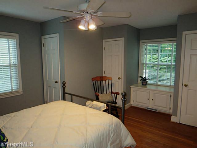 1760 Robinhood Road Winston-Salem, NC 27104 - Photo 9 of 16 2nd Bedroom. Beautiful wood floors. Lots of closet space (3 closets for this bedroom). Storage space under window.