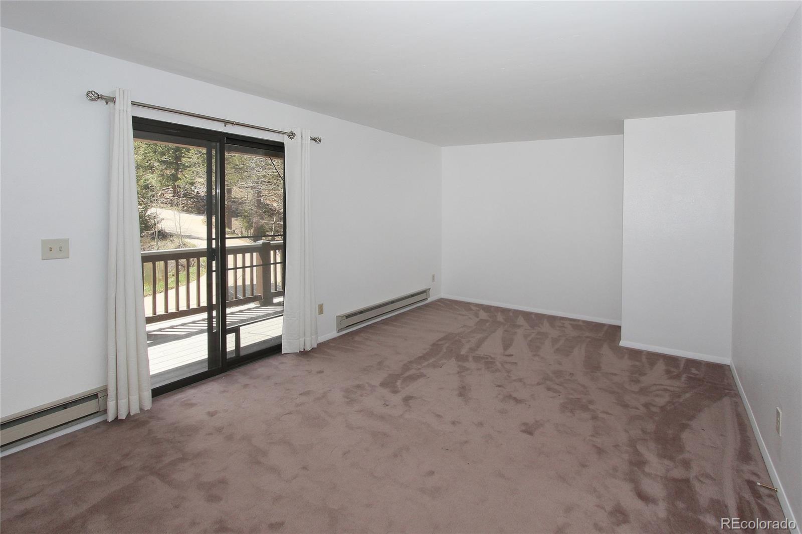 6250 Waterfall Loop Manitou Springs, CO 80829 - Photo 14 of 36 an empty room with windows