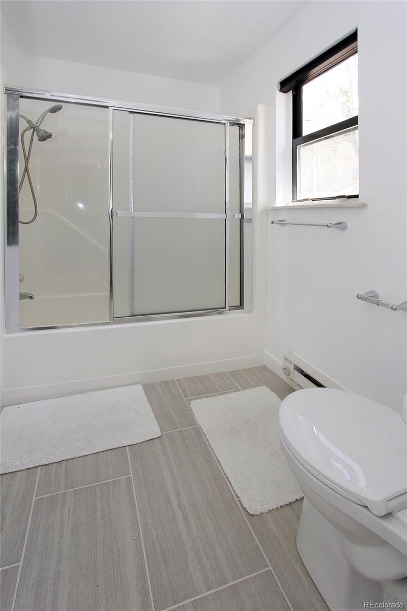 6250 Waterfall Loop Manitou Springs, CO 80829 - Photo 16 of 36 a bathroom with a toilet and a shower