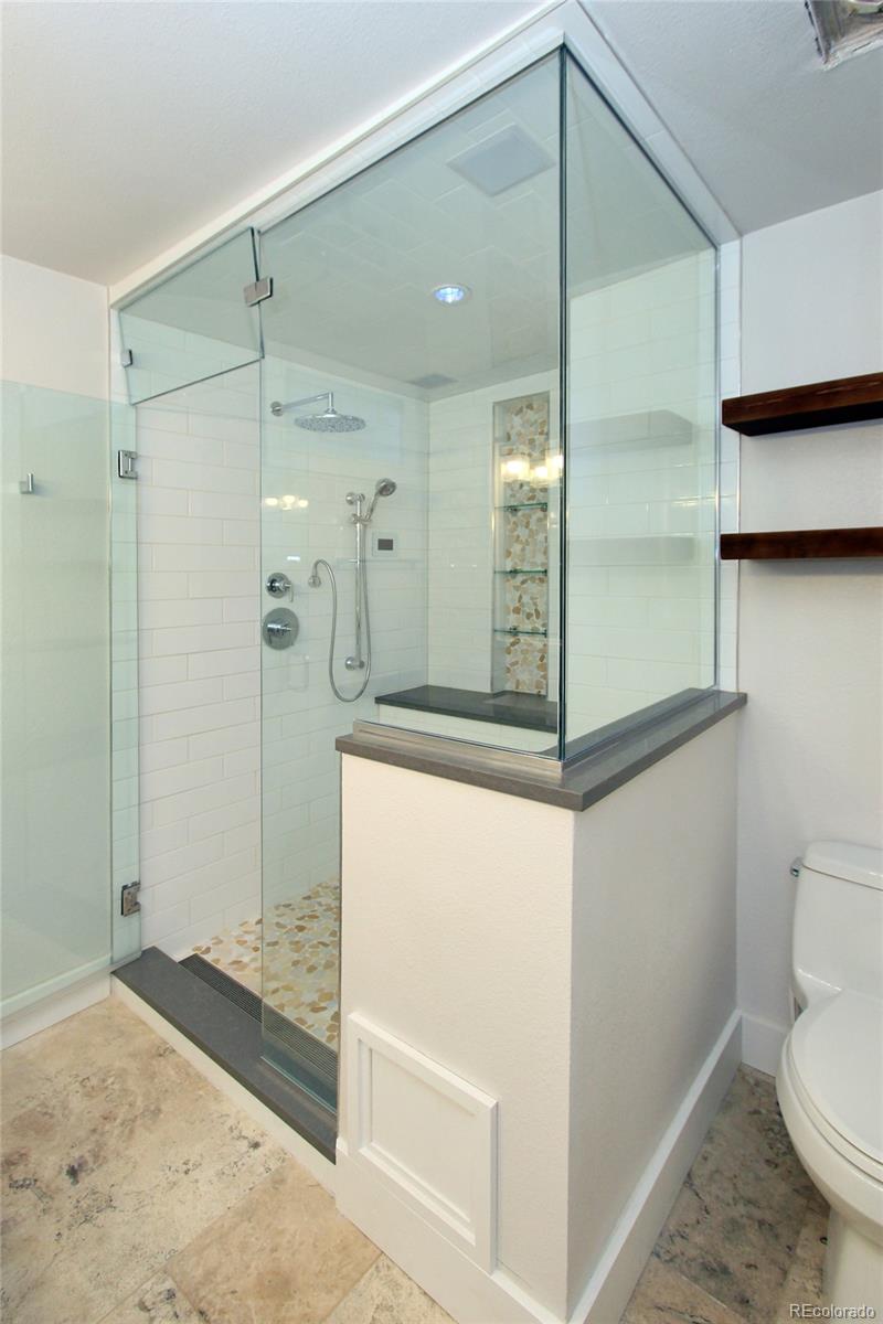 6250 Waterfall Loop Manitou Springs, CO 80829 - Photo 17 of 36 a bathroom with a shower and a sink