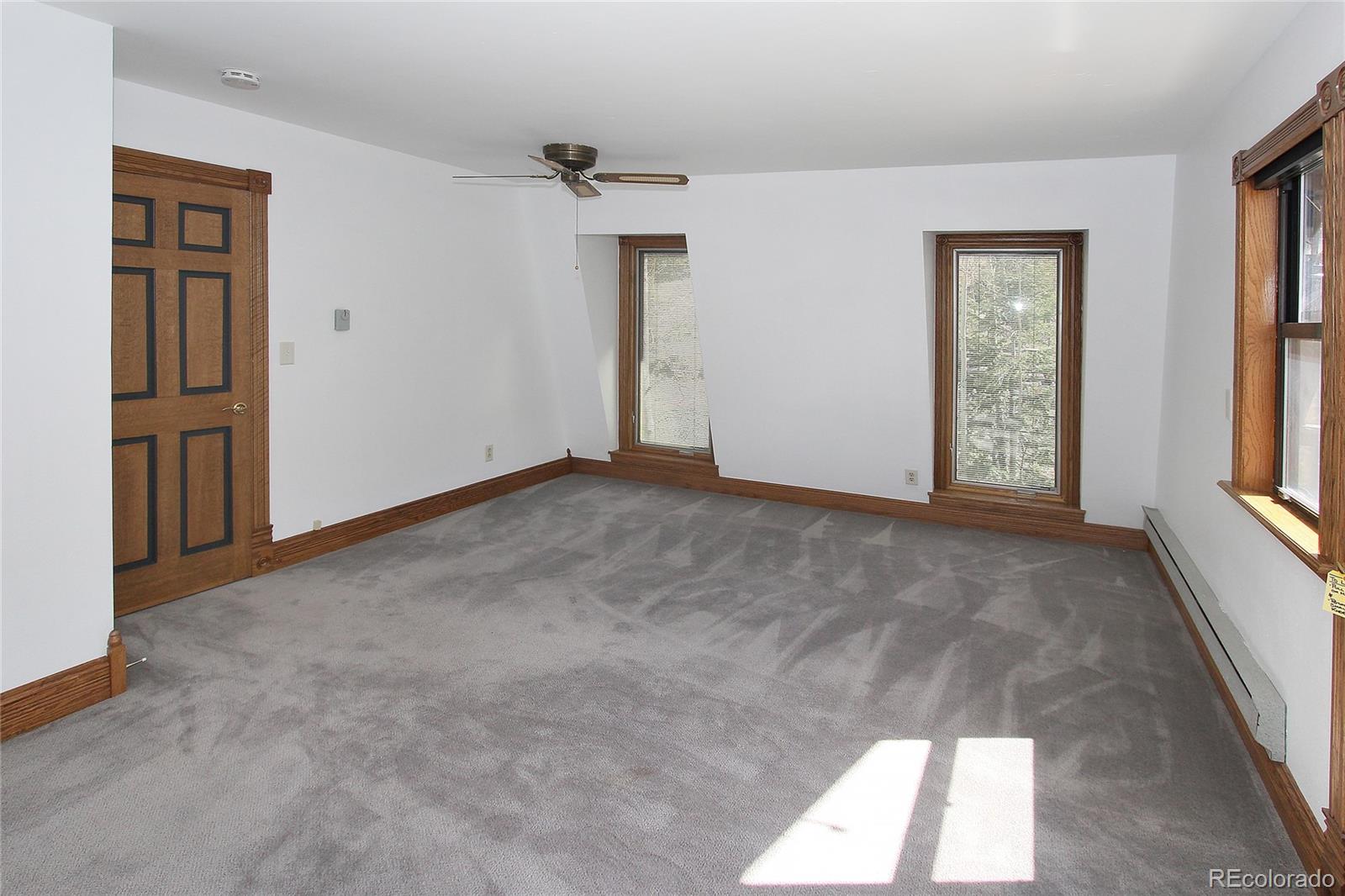 6250 Waterfall Loop Manitou Springs, CO 80829 - Photo 19 of 36 an empty room with windows and closet