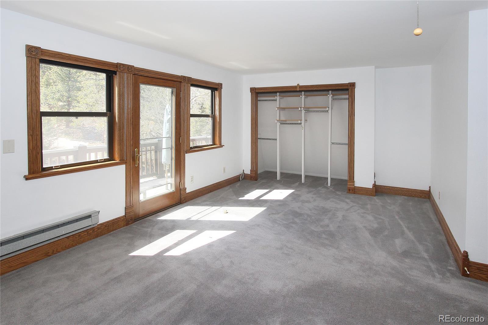 6250 Waterfall Loop Manitou Springs, CO 80829 - Photo 20 of 36 an empty room with windows and closet