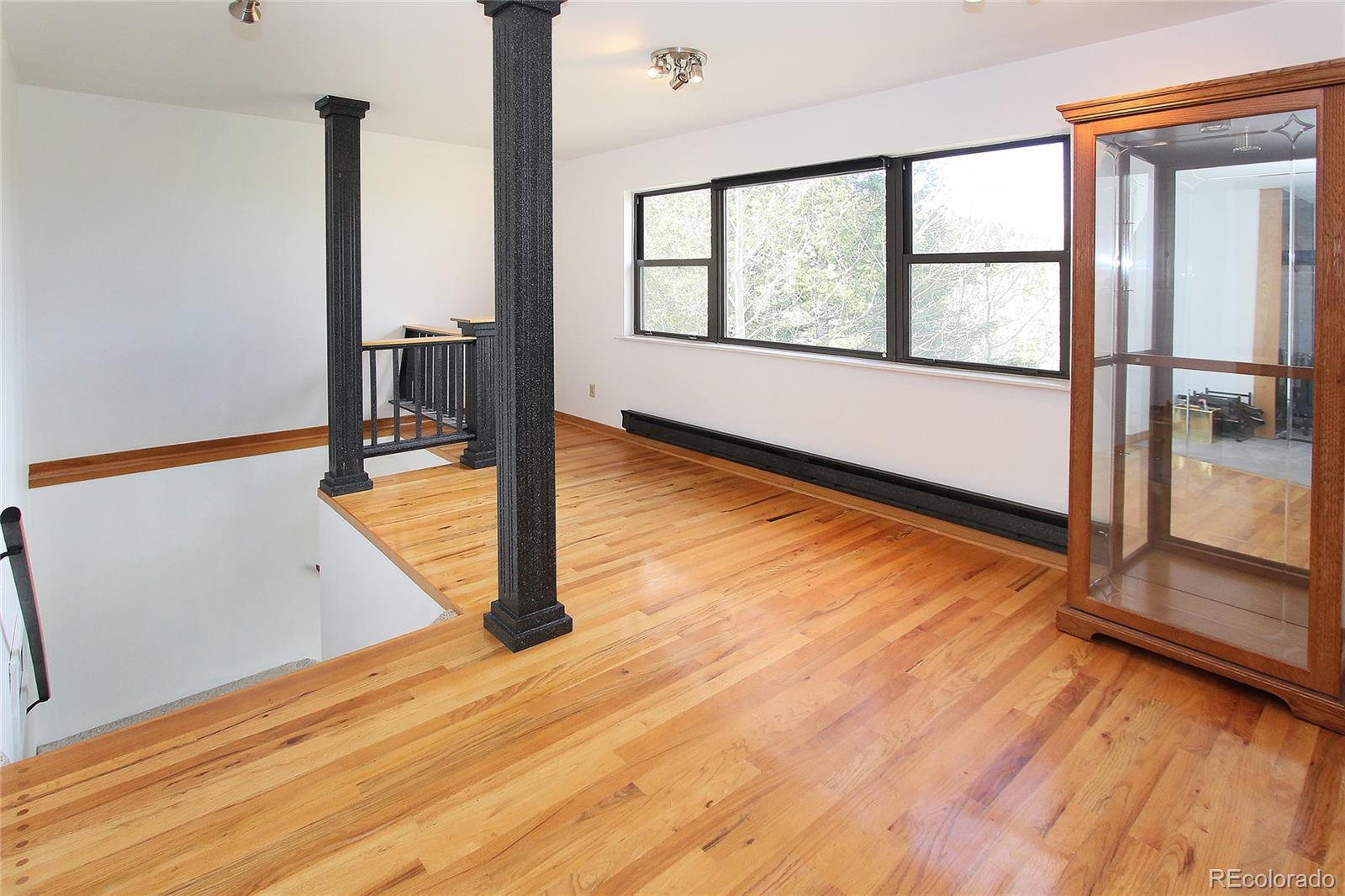 6250 Waterfall Loop Manitou Springs, CO 80829 - Photo 26 of 36 a view of a room with wooden floor