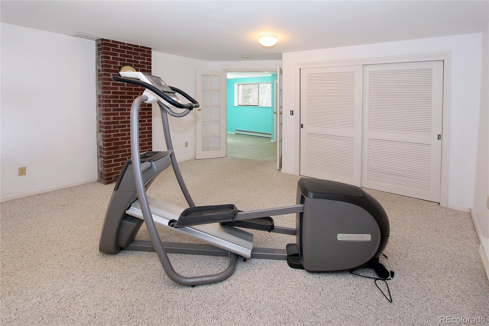 6250 Waterfall Loop Manitou Springs, CO 80829 - Photo 28 of 36 a room with gym equipment and white walls