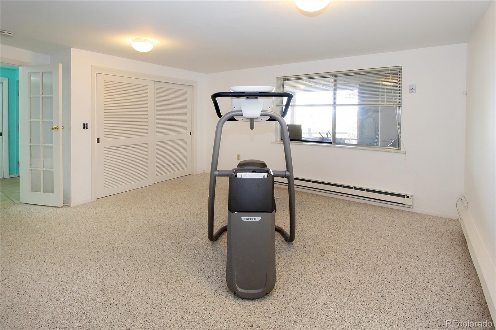 6250 Waterfall Loop Manitou Springs, CO 80829 - Photo 29 of 36 a room with gym equipment and a window