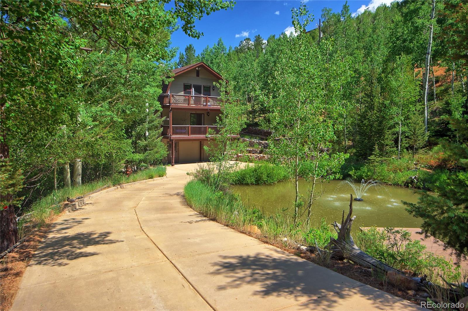 6250 Waterfall Loop Manitou Springs, CO 80829 - Photo 31 of 36 a view of a garden with a fountain
