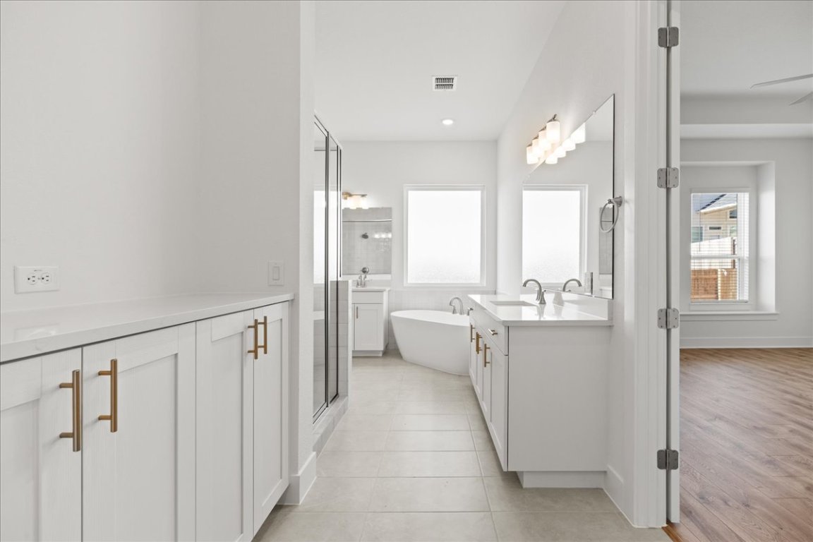 220 Begonia Street Buda, TX 78610 - Photo 14 of 24 a view of kitchen with stainless steel appliances kitchen island sink and refrigerator