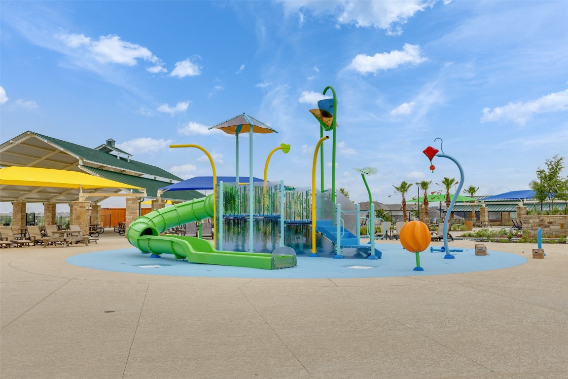 220 Begonia Street Buda, TX 78610 - Photo 23 of 24 a childrens park with lots of swings and slides