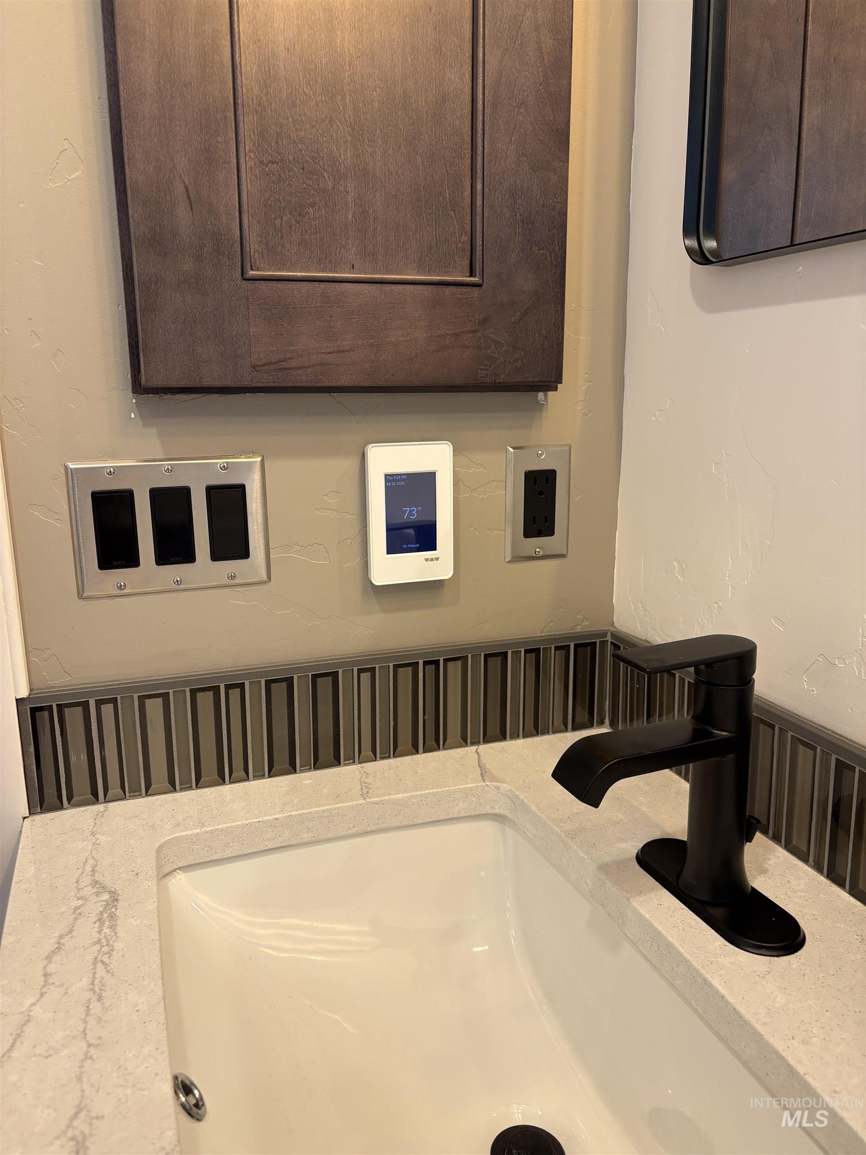 513 Ridge Way Ontario, OR 97914 - Photo 29 of 29 Integrated sink with a light-toned countertop, featuring a matte black single-handle faucet