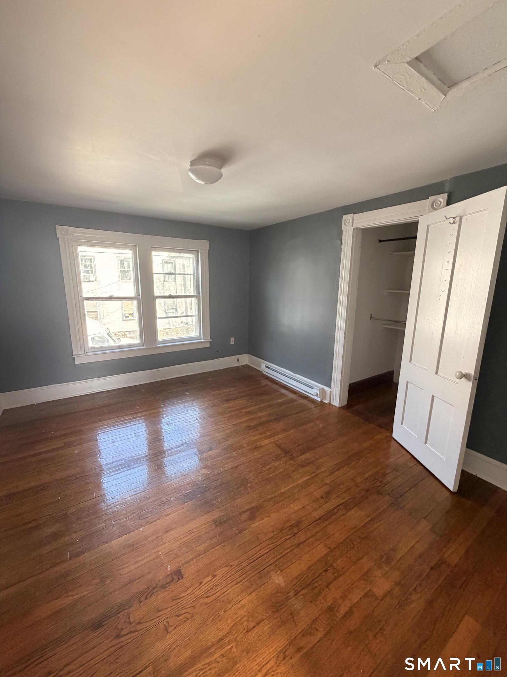 30 Sunset Avenue Waterbury, CT 06708 - Photo 7 of 9 an empty room with wooden floor and window