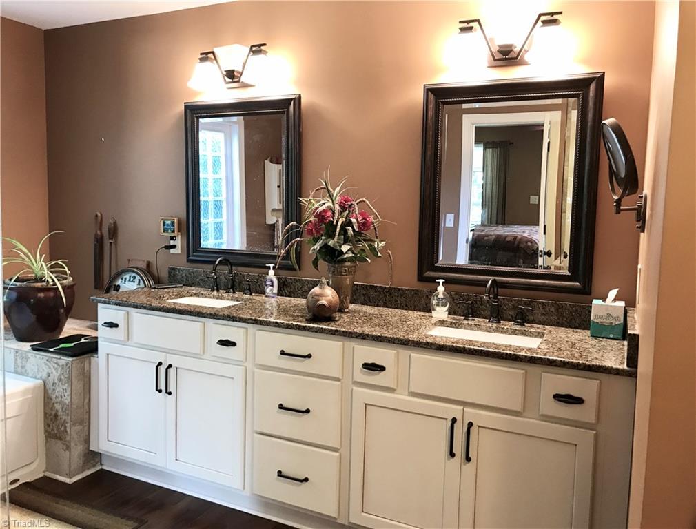 310 Cornatzer Road Mocksville, NC 27028 - Photo 26 of 46 The en-suite provides his/her cabinets and sinks.