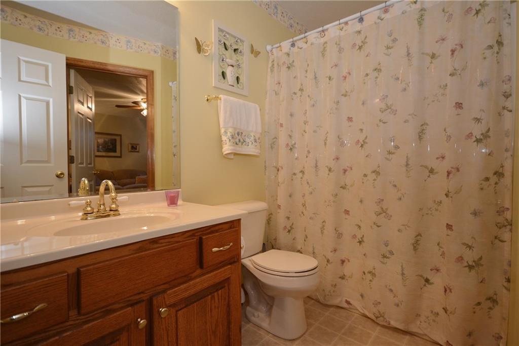 106 East Country Barn Road Houston, PA 15342 - Photo 15 of 25 Attached bathroom to the multi purpose room. This could also be considered a first floor master bedroom and bath.