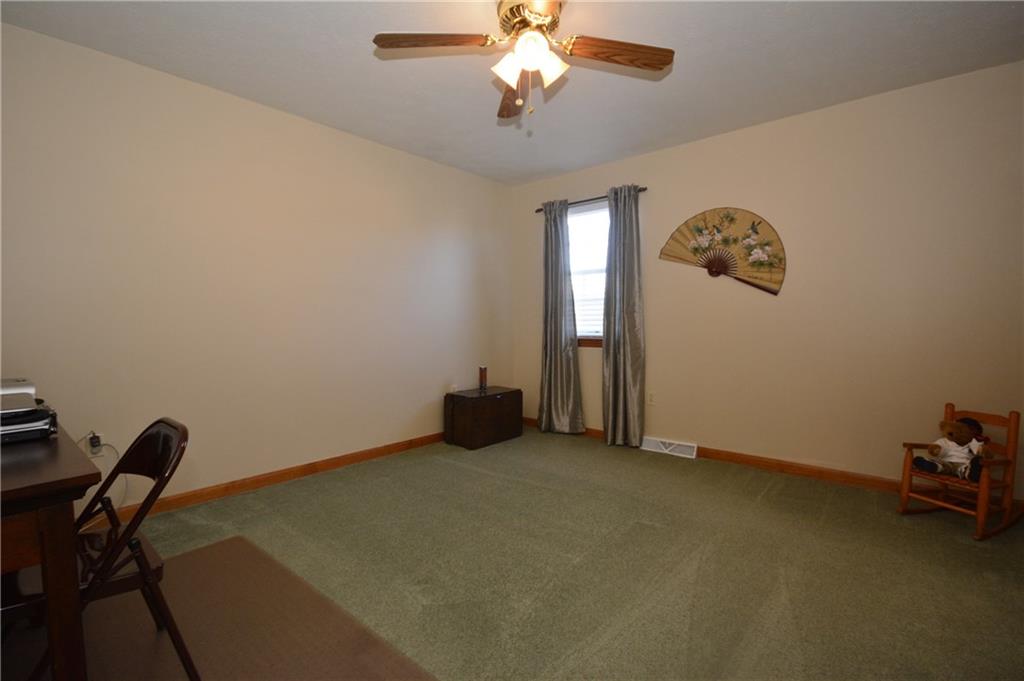 106 East Country Barn Road Houston, PA 15342 - Photo 21 of 25 The third bedroom has a ceiling fan and neutral palette.