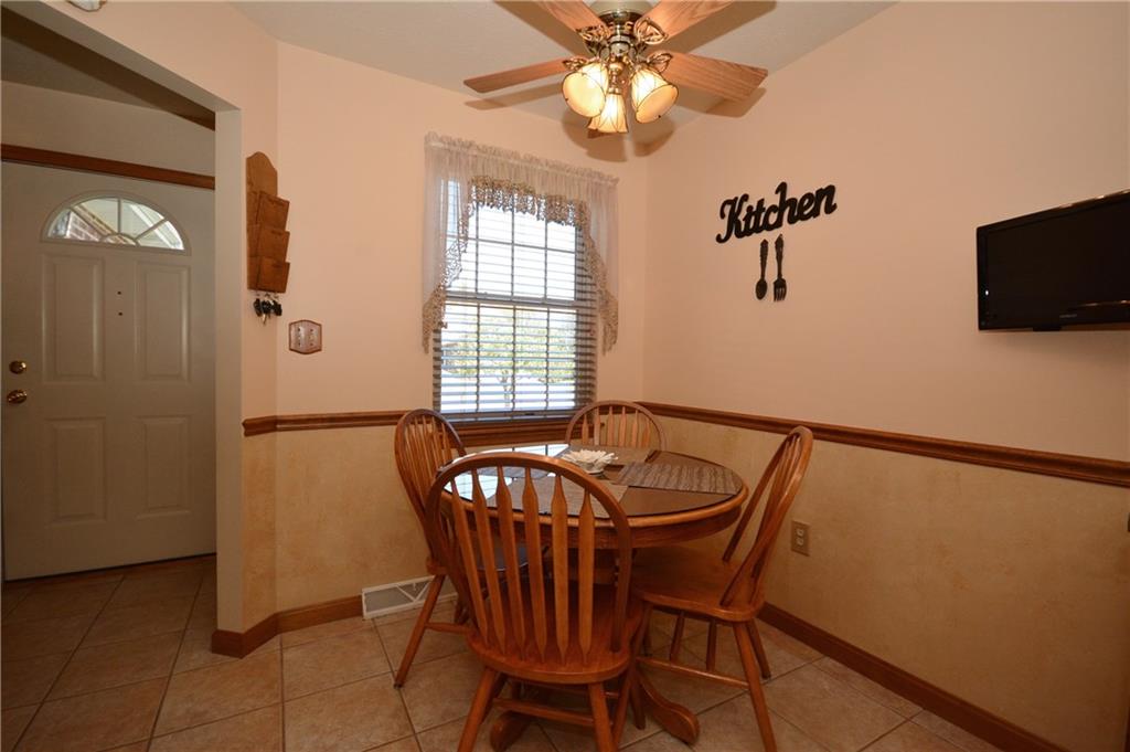 In the kitchen, there is a cozy breakfast nook with a window letting in great natural light.  