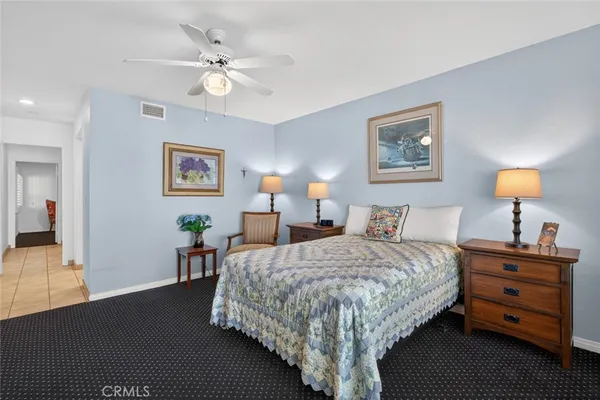 a bedroom with bed and a window