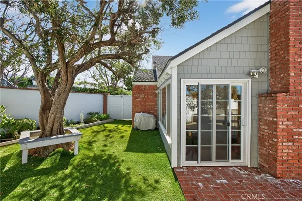 a view of a house with outdoor space and sitting area