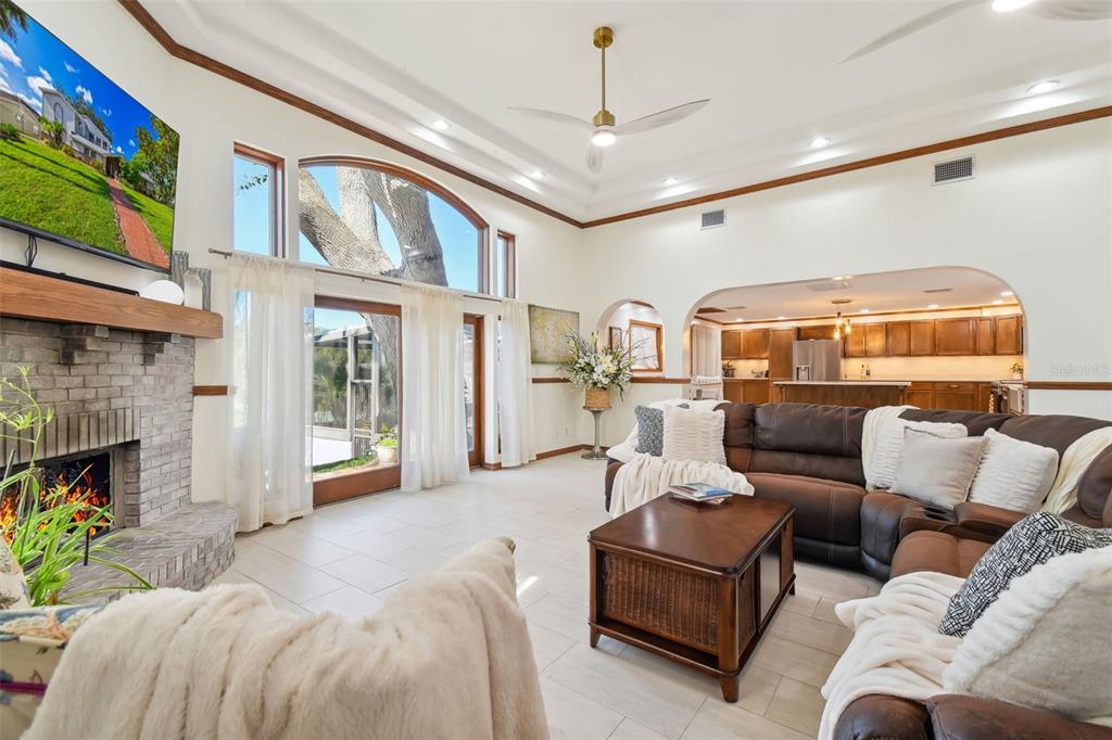 6128 Oak Ridge Avenue New Port Richey, FL 34653 - Photo 12 of 55 a living room with furniture and a fireplace