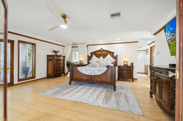 a bedroom with a bed and a desk