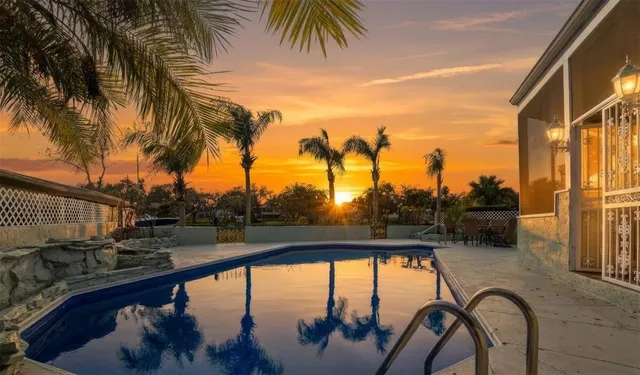 a kitchen with stainless steel appliances granite countertop a stove oven and a refrigerator with white cabinets