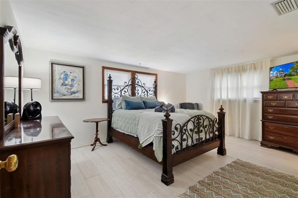 6128 Oak Ridge Avenue New Port Richey, FL 34653 - Photo 21 of 55 a bedroom with a bed and a desk