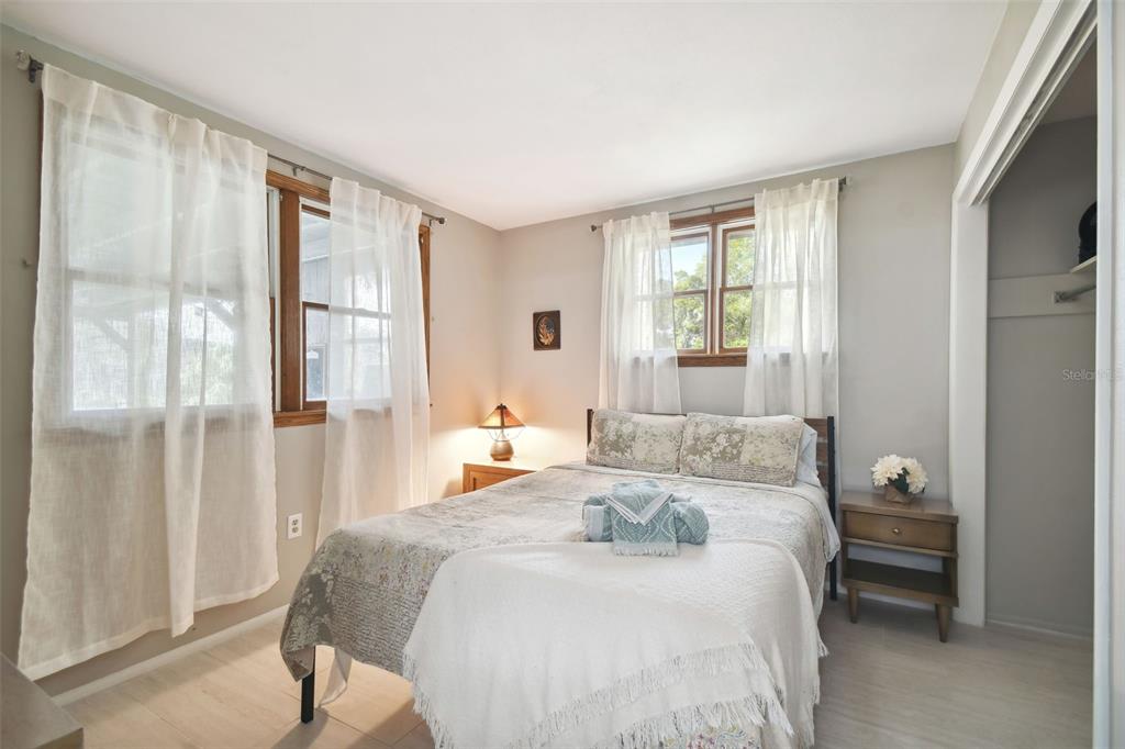 6128 Oak Ridge Avenue New Port Richey, FL 34653 - Photo 33 of 55 a bedroom with a bed and a window