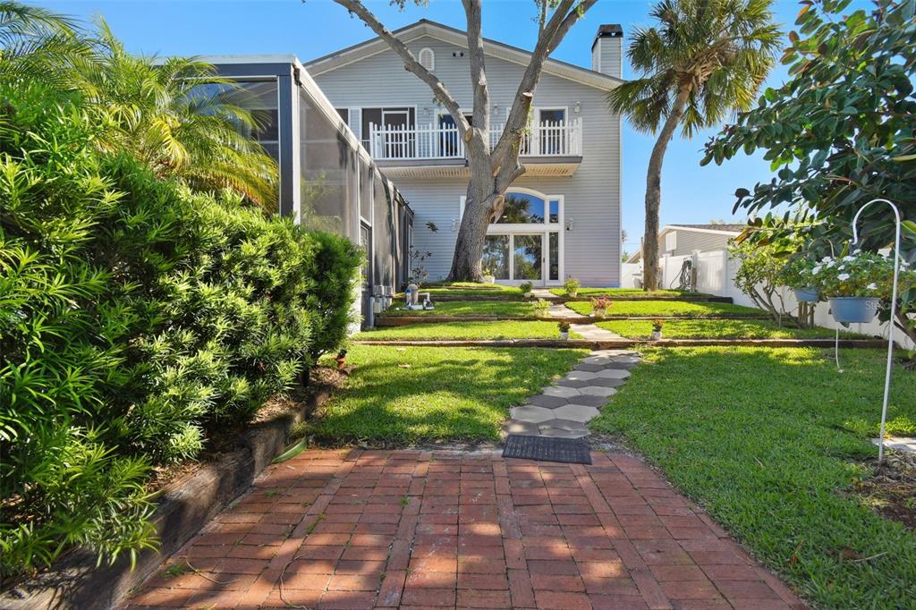 6128 Oak Ridge Avenue New Port Richey, FL 34653 - Photo 42 of 55 a front view of a house with a yard