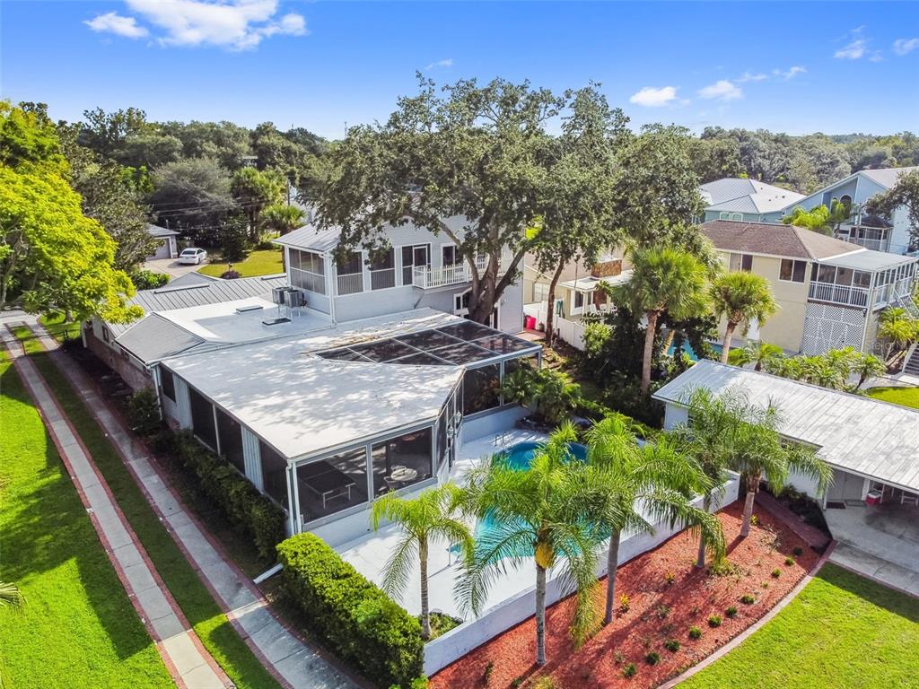 6128 Oak Ridge Avenue New Port Richey, FL 34653 - Photo 5 of 55 an aerial view of a house with swimming pool garden and patio