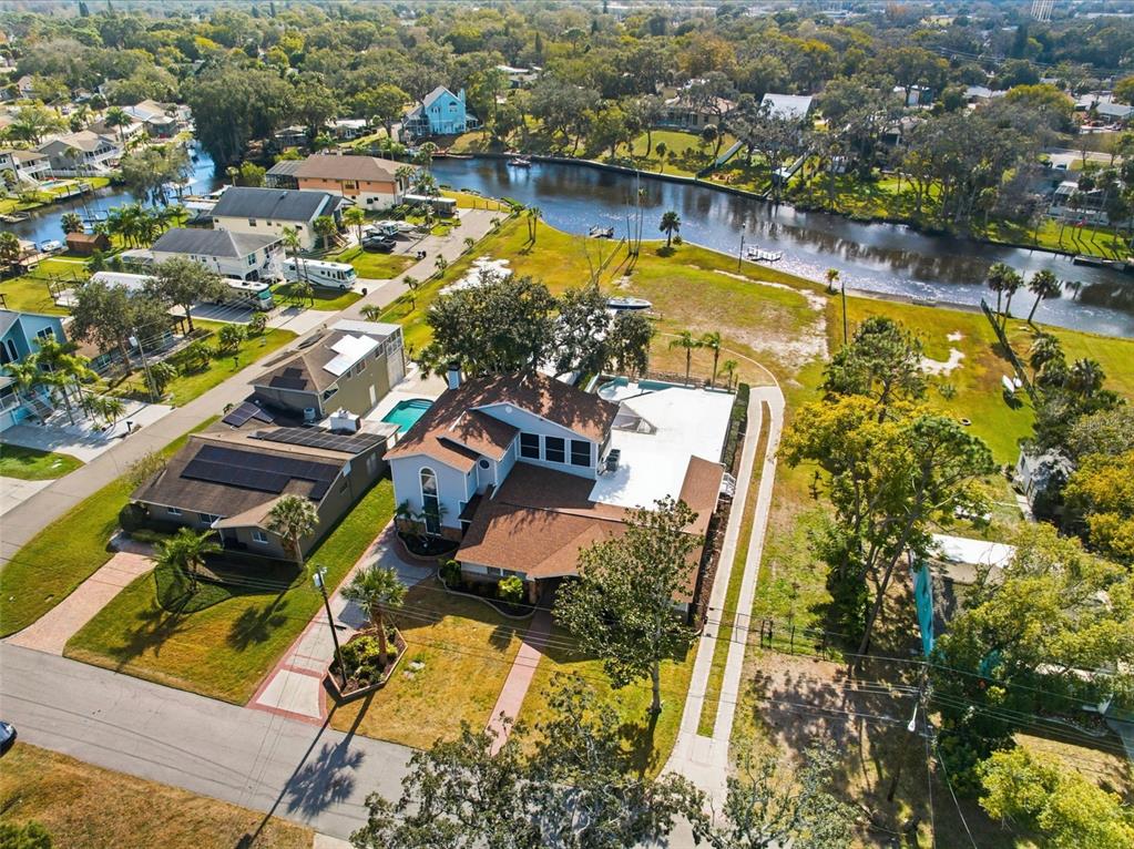 6128 Oak Ridge Avenue New Port Richey, FL 34653 - Photo 54 of 55 an aerial view of residential houses with outdoor space and swimming pool
