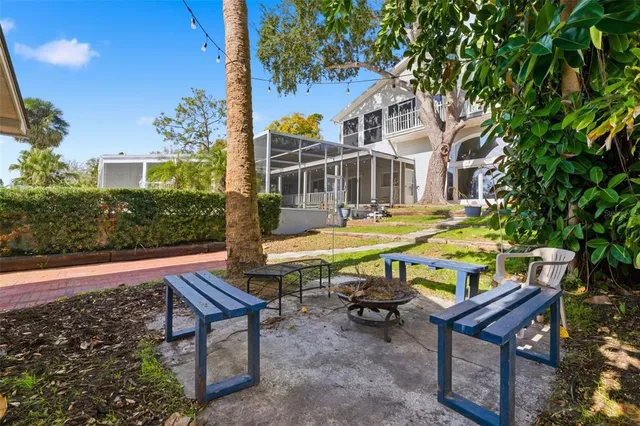 a living room with furniture fireplace and flat screen tv