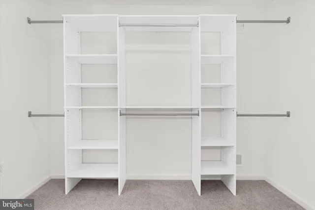 a bathroom with a double vanity sink mirror and